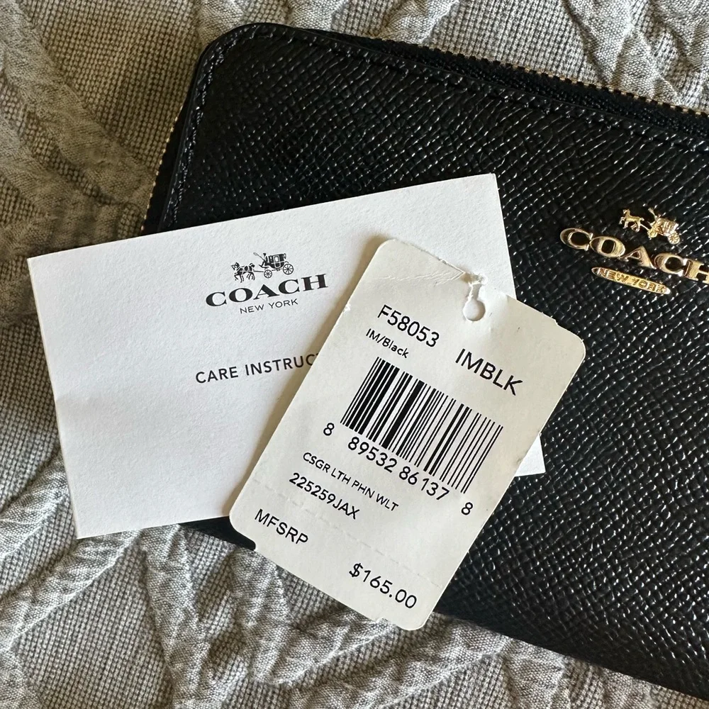 Coach wristlet zip around black pebble wallet
